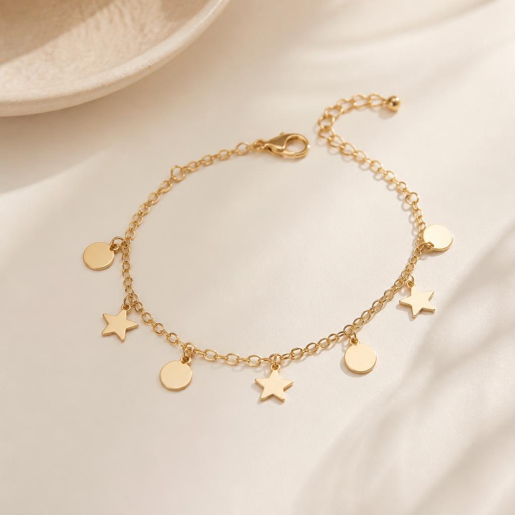 Alina Charm Bracelet photographed on a warm ivory background