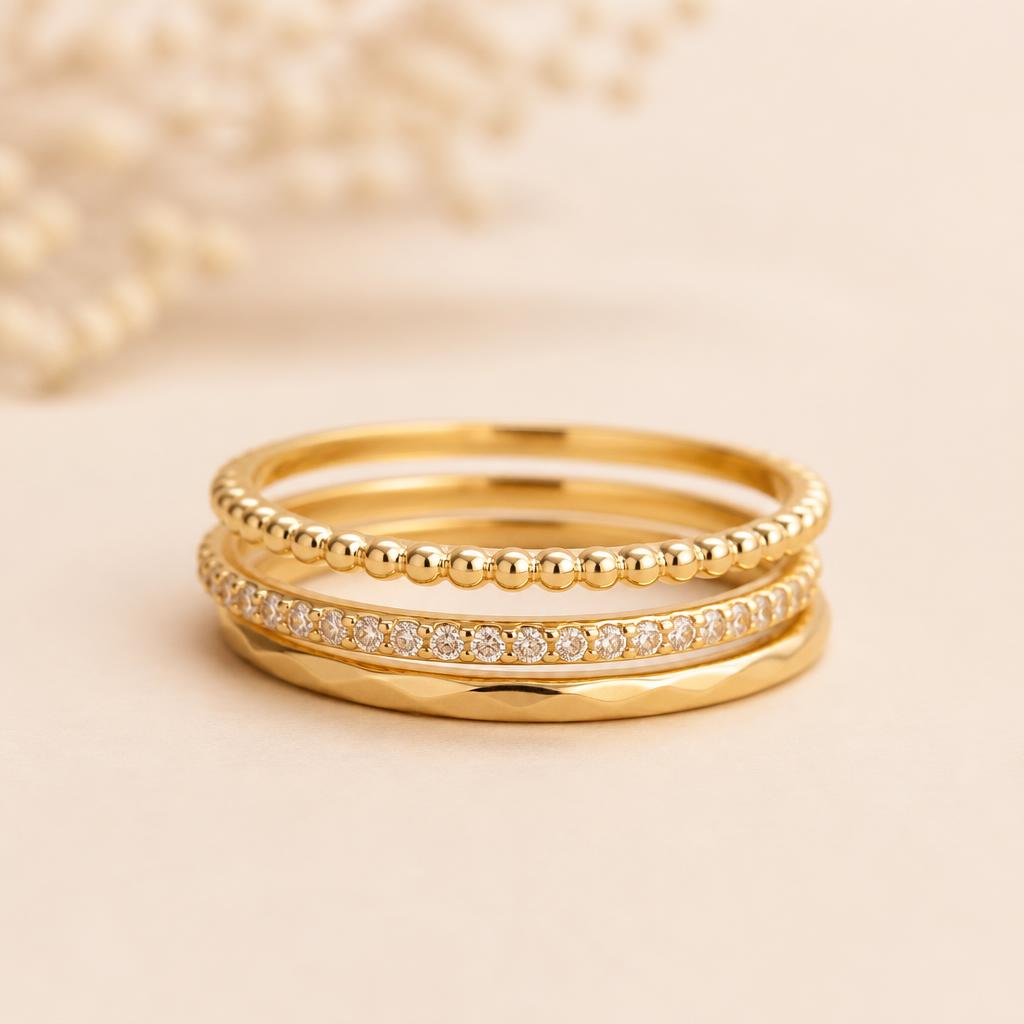 Mira Stackable Ring Set photographed on a warm ivory background